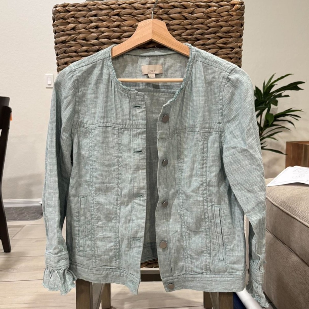 LOFT light blue/gray linen jacket with ruffle detailing.